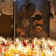 Photo of Kimani Gray and his younger sister is illuminated by candles at memorial, March 13, 2013. (Allison Joyce/Getty Images)